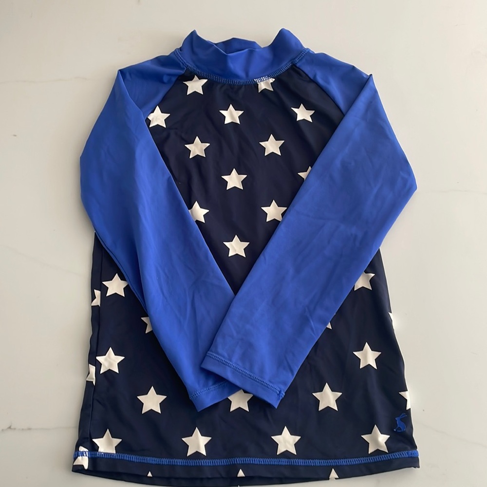 Mini Boden kid’s rash guard navy with blue sleeves and white stars